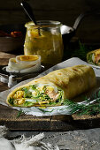 Tortilla wrap with salmon, egg, rocket and mustard and dill sauce