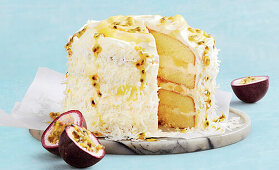 Lemon curd cake with passion fruit and coconut flakes