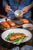 Baked salmon on steamed vegetables