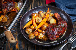 Roast chicken thighs with potatoes and carrots