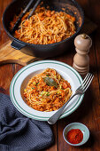 Spaghetti with chicken and lentil ragout