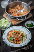 Pork chops with vegetables, mashed potatoes and cucumber salad