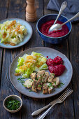 Chicken breast with beet puree, potatoes and braised cabbage