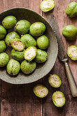 Green walnuts, partly halved, for walnut liqueur