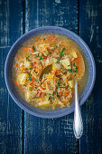 Sauerkraut soup with potatoes and vegetables