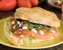 Ciabatta sandwich with smoked salmon and vegetables