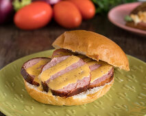 Grilled sausage sandwich with mustard sauce