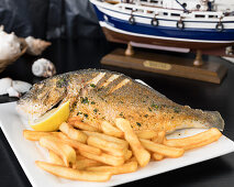 Grilled sea bream with chips