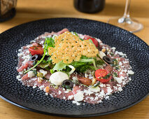 Carpaccio with rocket and parmesan