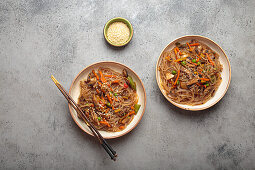 Japchae - Korean glass noodles with vegetables and sesame seeds