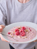 Overnight oats with fresh raspberries and hazelnuts