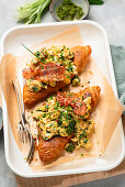 Scrambled egg croissant with bacon and wild garlic pesto