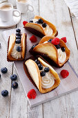 Biscuit tacos with cream filling and fresh berries