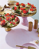 Beetroot and salmon blinis with pickled apple and celery