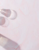 Light pink background with shades of glass