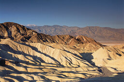 Sunlit mountains, Zabriskie Point, Death Valley, California, USA