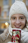 Girl with cap drinking tea, Winter Christmas Coldness