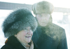 Old couple wearing fur hats, Omsk, Siberia