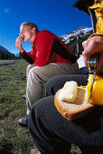 Hikers at lunch time with cheese, Dorfertal, Hohe Tauern, Austria
