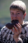 Boy enjoying Pastry, Isafj?rdur, Iceland