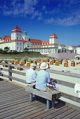 Senior couple looking to the beach, Ruegen, Mecklenburg-Western Pomerania, Germany, Baltic Sea