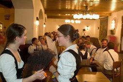 Girls dancing the traditional Kathreintanz dance with fan, Loewenbraeukeller, Munich, Bavaria, Germany