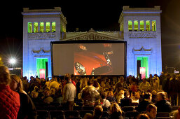 Spectators in front of the silver screen of an open air cinema, Koenigsplatz, Munich, Bavaria, Germany, Europe