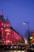 The illuminated Printemps department store in the evening, Paris, France, Europe