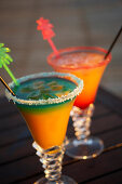 Colourful cocktails at the pool of Hotel Restaurant Le Rayon Vert in the evening, Deshaies, Basse-Terre, Guadeloupe, Caribbean Sea, America