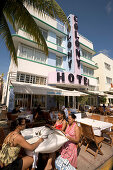 People at side walk cafe in front of Colony hotel, Ocean Drive, South Beach, Miami, Florida, USA, America