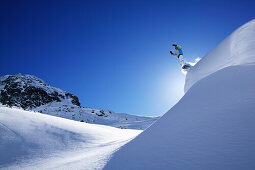 Snowboarder on mount Alpkogel, Wirl near Galtuer, Tyrol, Austria
