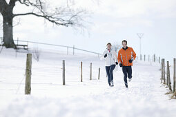 Young couple running on trail