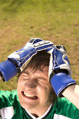 Frustrating young goalkeeper about goal against