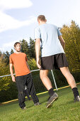 Young men playing soccer