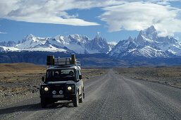Car on road in front of Mount Fitz Roy, El Caltén, Patagonia, Argentina, South America, America
