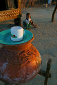 Drinking water in terracotta pot, Wasser aus dem Tontopf, Wasserbehaelter stehen ueberall in Burma traditional water urn, drinking water in terracotta vessel