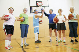 Mature People playing basketball