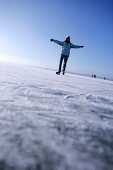 Young woman ice skating