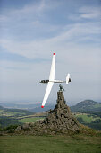 Glider Airplane behind Aviator Monument, Wasserkuppe Mountain, Rhoen, Hesse, Germany