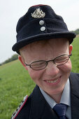 Young Firefighter with Quirky Smile, Simmershausen Festival, Hilders-Simmershausen, Rhoen, Hesse, Germany