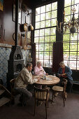 People, Het Papeneiland, Jordaan, People sitting in Het Papeneiland, the oldest brown or bruin cafe, Jordaan, Amsterdam, Holland, Netherlands