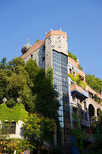 View at part of the Hundertwasser house under a blue sky, Vienna, Austria