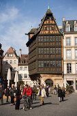 Place de la Cathedrale and Maison Kammerzell, View over the busy Place de la Cathedrale Cathedral Square, to one of the oldest and loveliest timbered houses the Maison Kammerzell, Strasbourg, Alsace, France