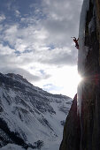 Man ice climbing, Stanley Headwall, Nightmare on Wolfstreet M7, British Colombia, Canada