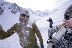 Young people having fun with snowball fight, Kuehtai, Tyrol, Austria