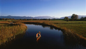 Rowboat on water, River Ach near Uffing, Staffelsee, Upper Bavaria, Germany