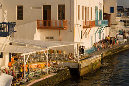 People sitting in restaurant directly at sea, Little Venice, Mykonos-Town, Mykonos, Greece