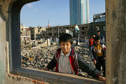 demolitian Hongkou, view through destroyed window, construction site playground, redevelopment area, living amongst demolished houses, slum