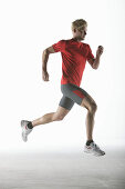 Runner, young man (20-25y) in motion