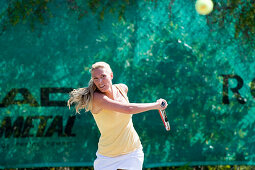 Young woman playing tennis, Apulia, Italy